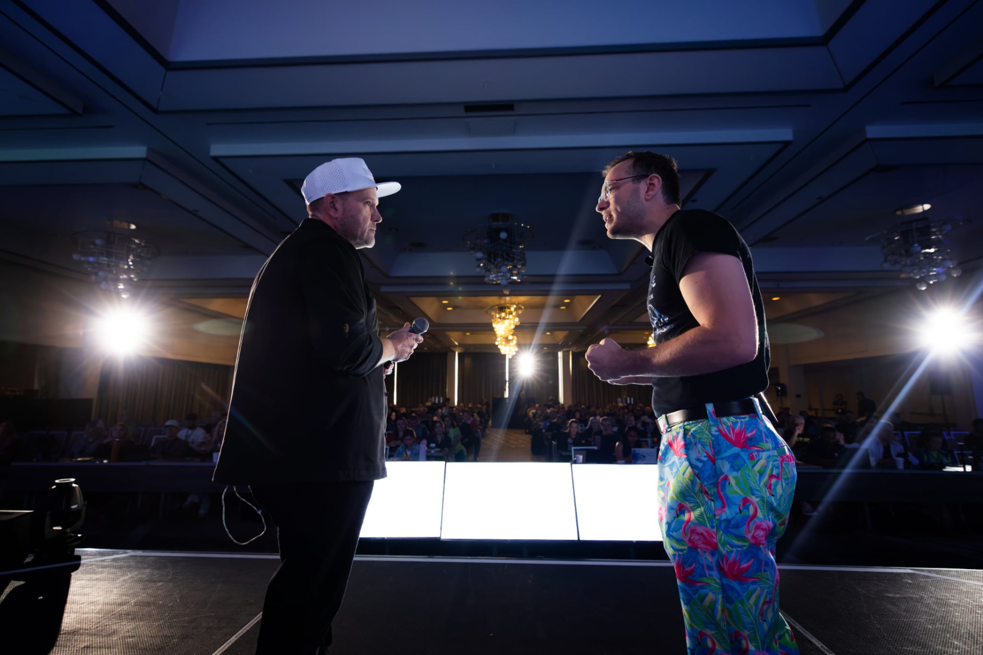Michael King Jr. and Austin Armstrong facing each other on stage in front of the AI Marketing World audience